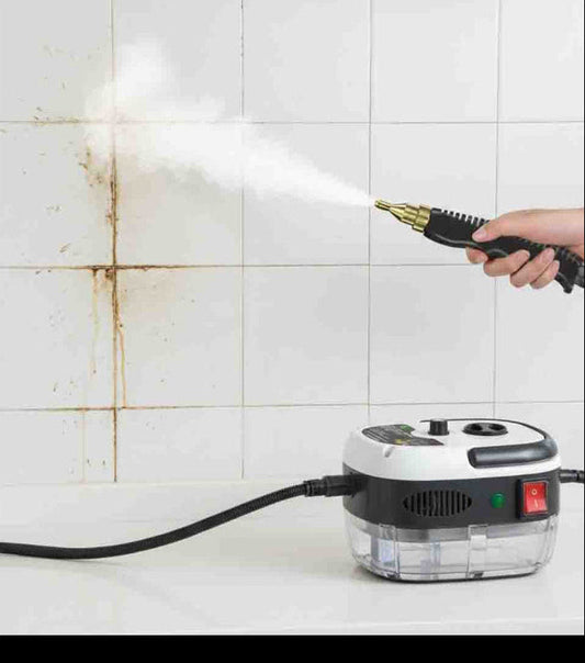 Person using a steam cleaner to clean a tiled wall


